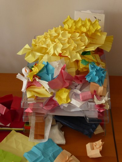 A heap of origami designs in draft stage
