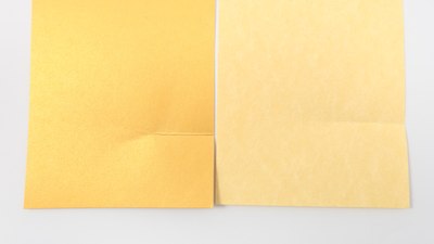 Different crease appearance in different paper types. Similar differences may appear in the same type of paper depending on crease direction relative to the grain.