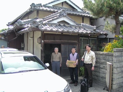 Shuzo Fujimoto in front of his home in Sasayama, Japan, with (left to right) Seiji Nishikawa and Koichi Tateishi. Picture by Robert Lang.