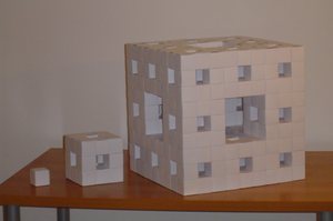 Three Menger Sponges made from the same kind of unit: levels 2, 1 and 0
