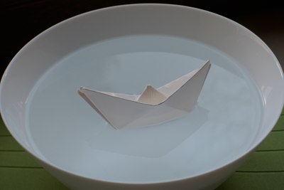 Traditional paper boat folded from cheese tray paper